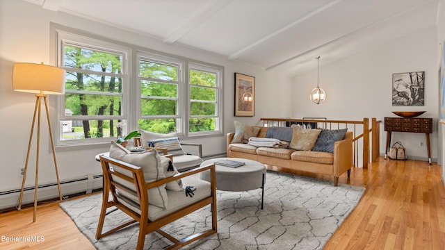 22 Delafield Dr, Lenox, MA 01240 - living area featuring healthy amount of natural light, a chandelier, light wood-style floors, and baseboard heating