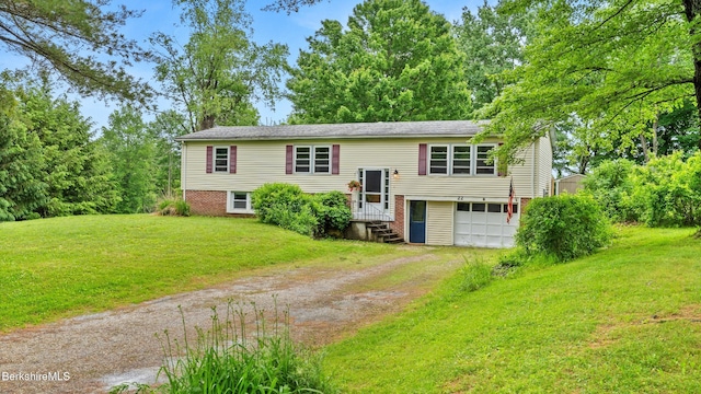 22 Delafield Dr, Lenox, MA 01240 - raised ranch featuring driveway, an attached garage, and a front lawn
