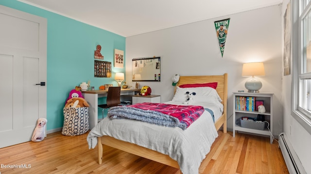 22 Delafield Dr, Lenox, MA 01240 - bedroom with a baseboard radiator, wood finished floors, and ornamental molding
