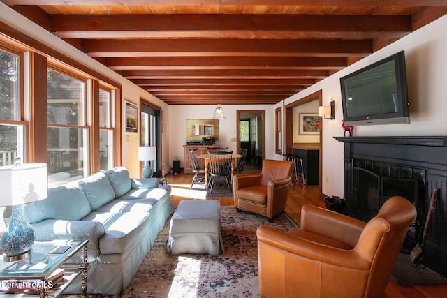 interior space featuring beam ceiling, wooden ceiling, and hardwood / wood-style floors