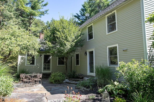 back of property featuring a patio