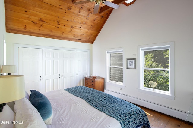 bedroom featuring dark hardwood / wood-style flooring, baseboard heating, ceiling fan, wooden ceiling, and vaulted ceiling with beams