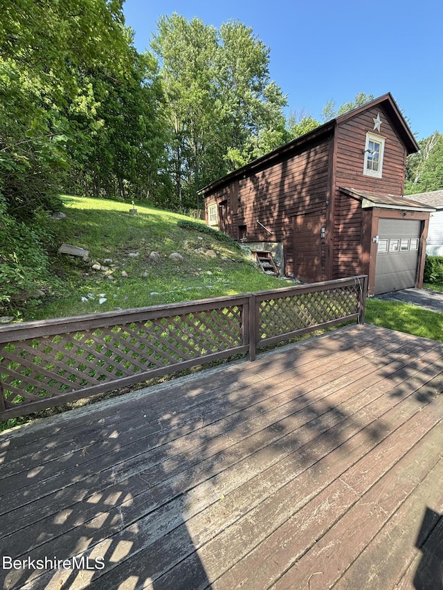 31 Millard Ave, Clarksburg, MA 01247 - wooden terrace with driveway and an attached garage