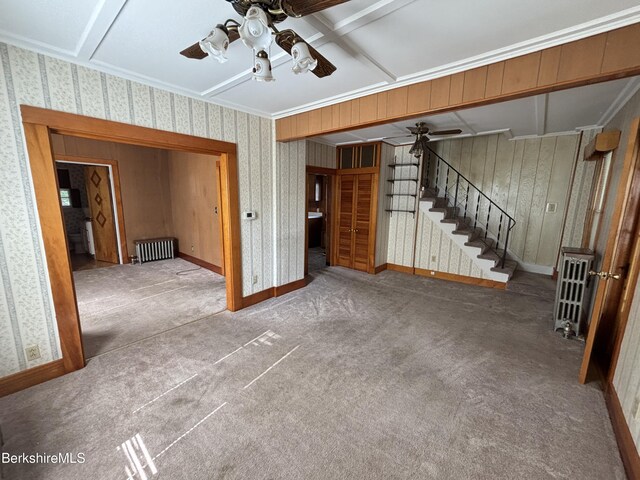 31 Millard Ave, Clarksburg, MA 01247 - unfurnished living room with a ceiling fan, stairway, radiator heating unit, wallpapered walls, and carpet