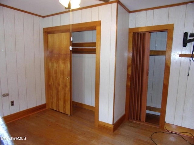 31 Millard Ave, Clarksburg, MA 01247 - unfurnished bedroom featuring wood finished floors, crown molding, and wooden walls