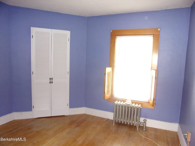 31 Millard Ave, Clarksburg, MA 01247 - unfurnished room with radiator and wood finished floors