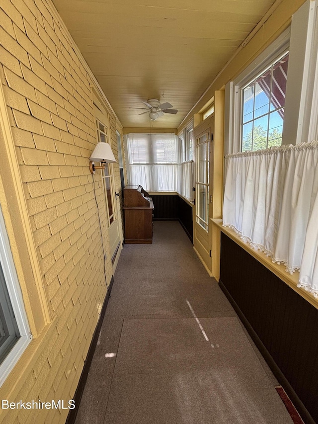 31 Millard Ave, Clarksburg, MA 01247 - unfurnished sunroom with brick wall, a ceiling fan, and carpet floors