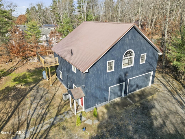 view of side of home featuring a garage