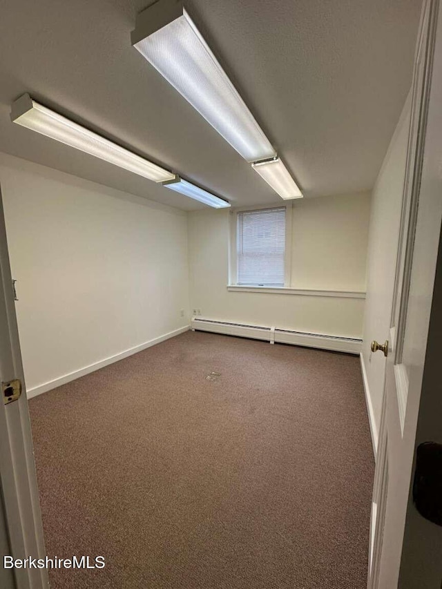 406 Main St, Great Barrington, MA 01230 - below grade area with a baseboard radiator, carpet floors, and baseboards