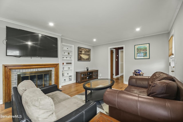 24 Henderson Rd, Williamstown, MA 01267 - living area with crown molding, built in shelves, recessed lighting, and wood finished floors