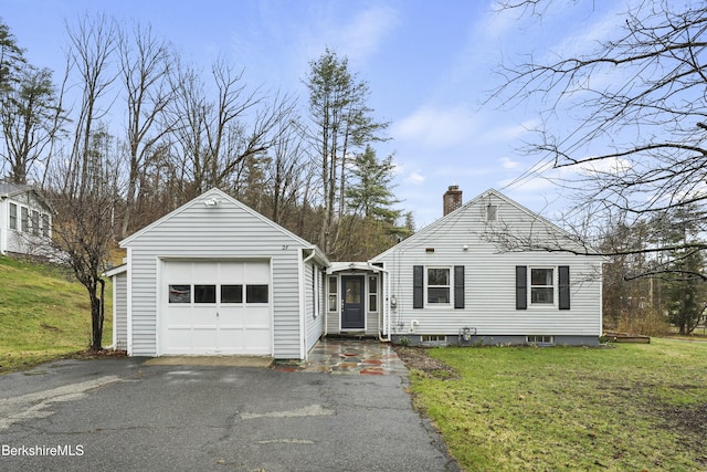 24 Henderson Rd, Williamstown, MA 01267 - view of front of property featuring an attached garage, a chimney, aphalt driveway, and a front lawn