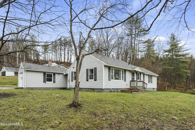 24 Henderson Rd, Williamstown, MA 01267 - view of front of house featuring roof with shingles and a front lawn