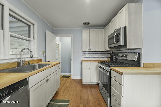 24 Henderson Rd, Williamstown, MA 01267 - kitchen featuring wooden counters, visible vents, appliances with stainless steel finishes, a sink, and wood finished floors
