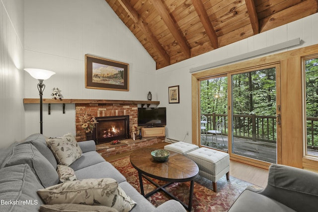 545 Leisure Lee Rd, Lee, MA 01238 - living room with a wood ceiling with exposed beams, wood finished floors, a brick fireplace, and high vaulted ceiling