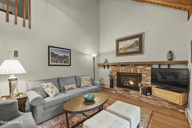 545 Leisure Lee Rd, Lee, MA 01238 - living area featuring wood finished floors, a fireplace, and lofted ceiling