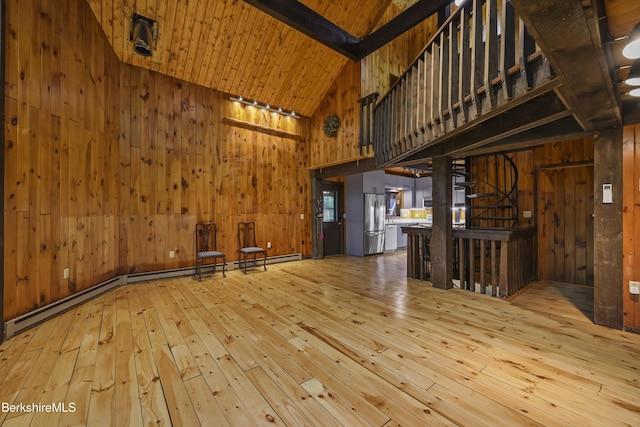 377 Highland Way, Sandisfield, MA 01255 - unfurnished living room featuring wood-type flooring, wooden walls, high vaulted ceiling, stairway, and beamed ceiling