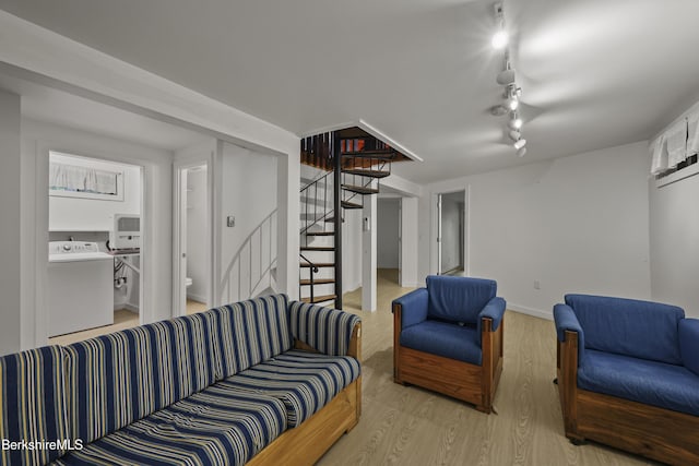 377 Highland Way, Sandisfield, MA 01255 - living room with washer / clothes dryer, stairway, wood finished floors, and rail lighting