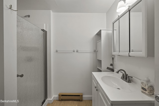 377 Highland Way, Sandisfield, MA 01255 - full bath featuring a baseboard radiator, a stall shower, vanity, and wood finished floors