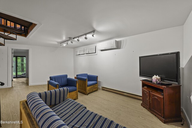 377 Highland Way, Sandisfield, MA 01255 - living room featuring a wall mounted AC, light wood-style floors, baseboard heating, rail lighting, and stairs