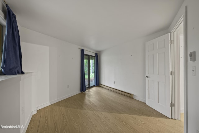 377 Highland Way, Sandisfield, MA 01255 - unfurnished room featuring a baseboard radiator and light wood finished floors