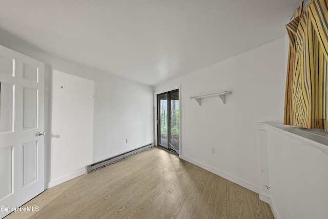 377 Highland Way, Sandisfield, MA 01255 - unfurnished room with baseboard heating and light wood-style floors