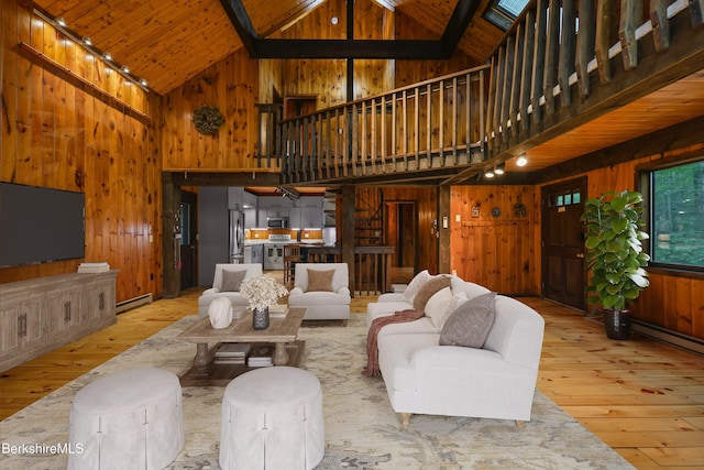 377 Highland Way, Sandisfield, MA 01255 - living room featuring hardwood / wood-style flooring, wood walls, high vaulted ceiling, a baseboard radiator, and a wood ceiling with exposed beams