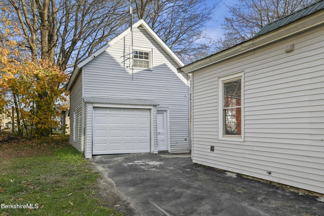 view of side of property with a garage