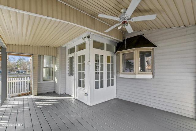 deck featuring a ceiling fan and fence