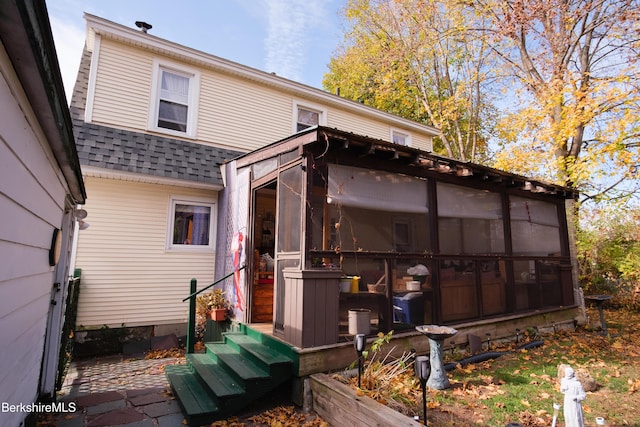 back of property featuring a sunroom