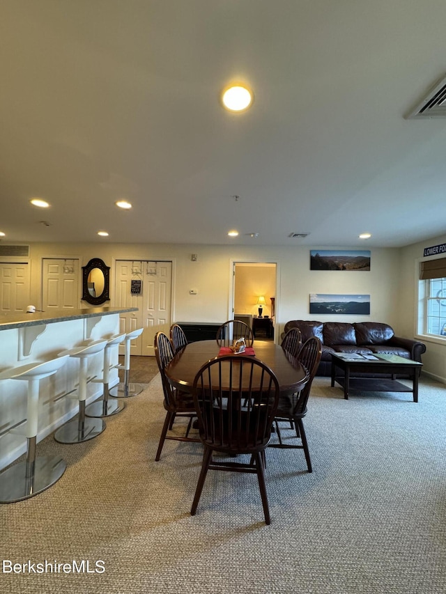 dining space featuring carpet flooring