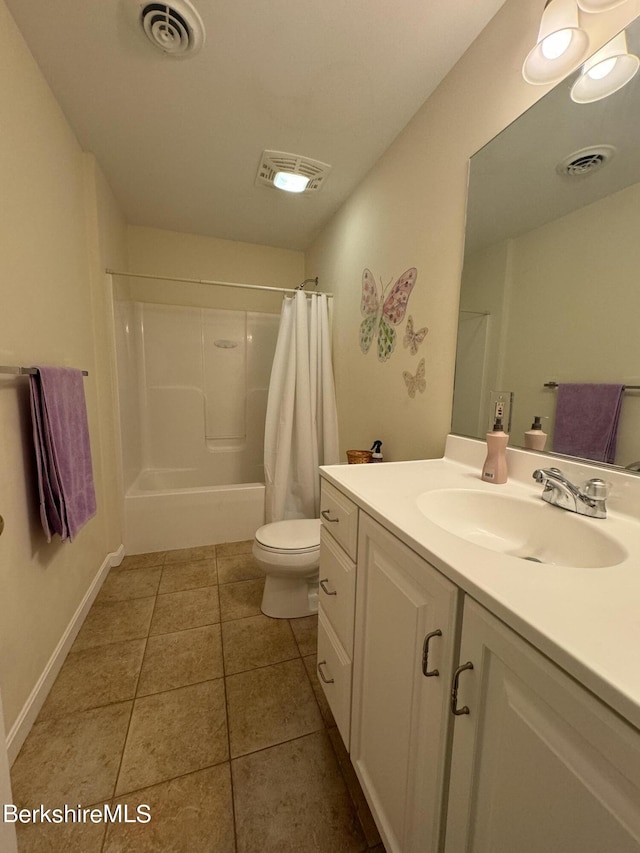 bathroom with tile patterned floors, vanity, and toilet