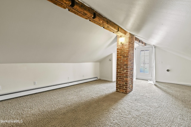 additional living space with a baseboard heating unit, vaulted ceiling with beams, carpet floors, and baseboards