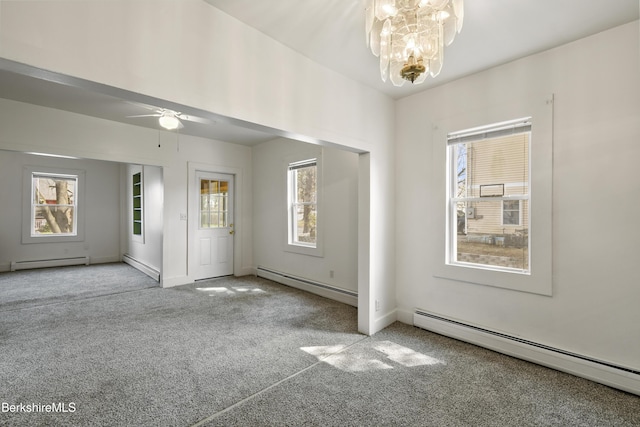 carpeted foyer with a baseboard radiator and ceiling fan with notable chandelier