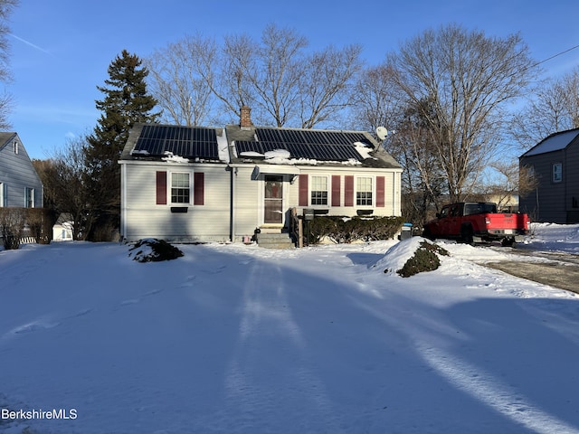 view of front of property with solar panels