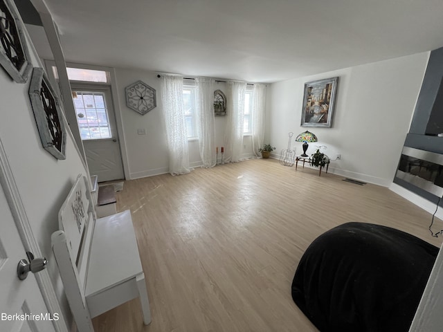 entrance foyer featuring visible vents, baseboards, and light wood-style flooring