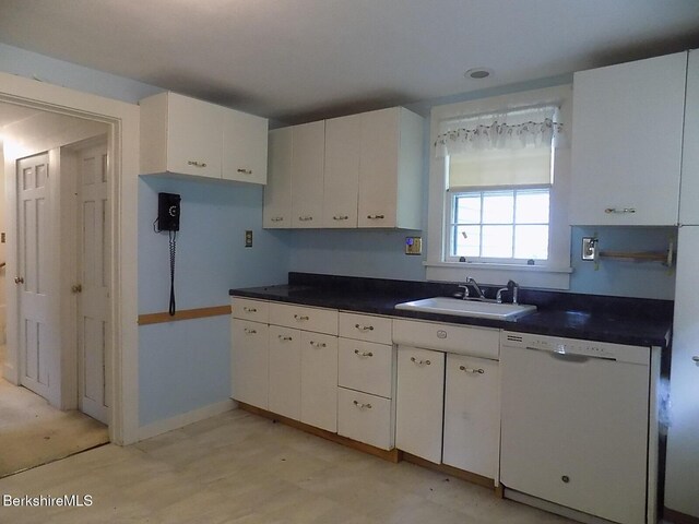 350 Laurel St, Lee, MA 01238 - kitchen with white dishwasher, a sink, dark countertops, and white cabinets