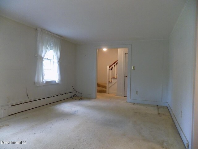 350 Laurel St, Lee, MA 01238 - empty room featuring a baseboard heating unit, stairs, and carpet flooring