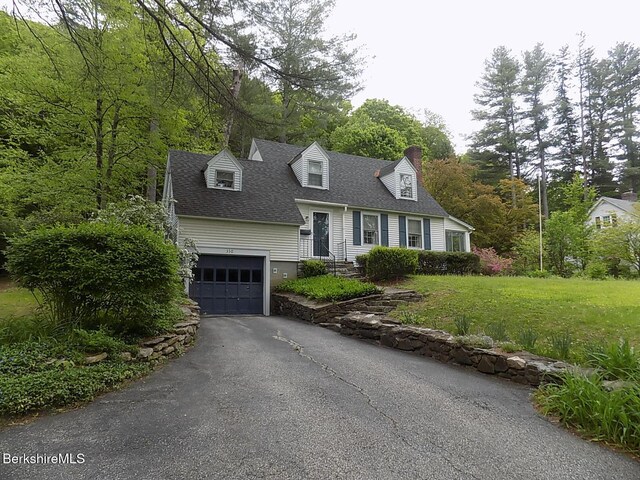 350 Laurel St, Lee, MA 01238 - cape cod house featuring roof with shingles, driveway, a front yard, a chimney, and an attached garage
