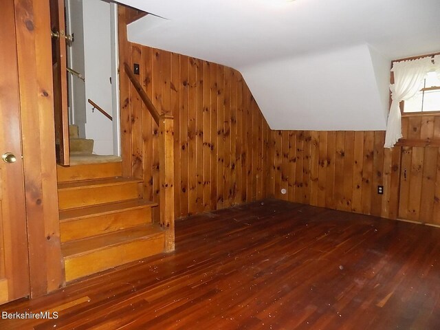 350 Laurel St, Lee, MA 01238 - additional living space featuring wood-type flooring, wooden walls, vaulted ceiling, and stairway