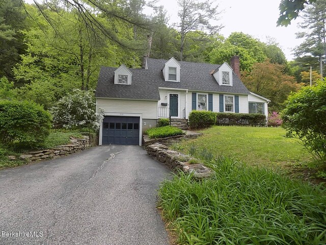 350 Laurel St, Lee, MA 01238 - cape cod house featuring roof with shingles, asphalt driveway, a chimney, a front lawn, and an attached garage