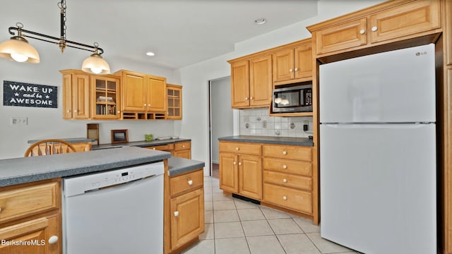 kitchen featuring white appliances, glass insert cabinets, light tile patterned floors, dark countertops, and decorative backsplash