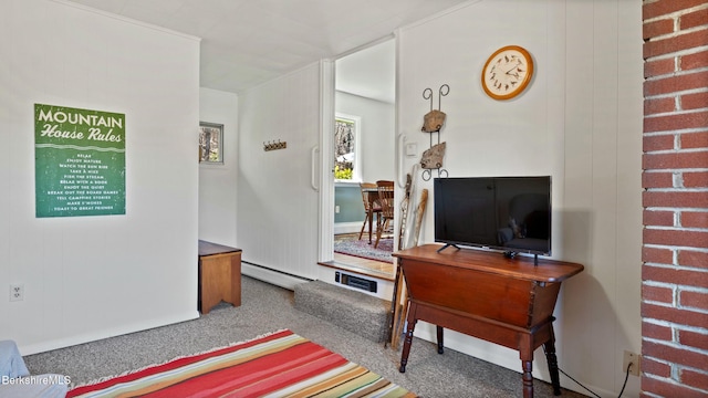 carpeted living room with visible vents and baseboard heating