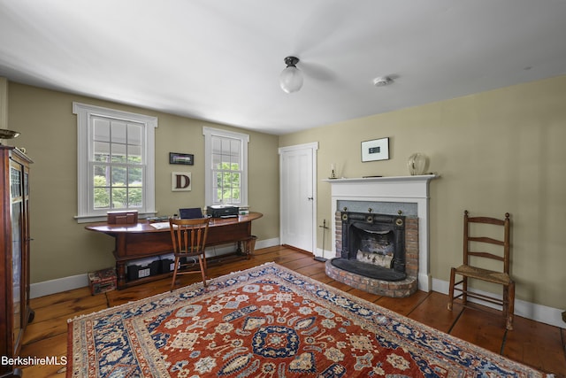 16 Glendale Middle Rd, Stockbridge, MA 01262 - home office featuring wood-type flooring, a brick fireplace, and baseboards