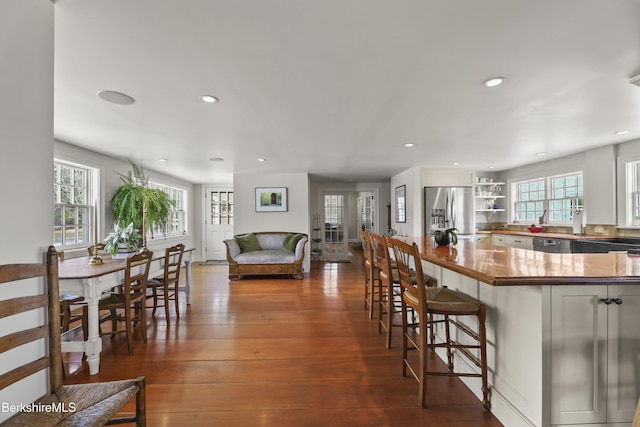 16 Glendale Middle Rd, Stockbridge, MA 01262 - kitchen with stainless steel fridge, open shelves, a breakfast bar, recessed lighting, and dark wood-style flooring