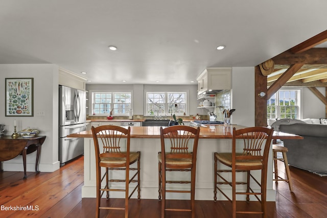 16 Glendale Middle Rd, Stockbridge, MA 01262 - kitchen featuring stainless steel fridge, a peninsula, plenty of natural light, dark wood-style floors, and recessed lighting