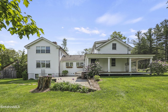 16 Glendale Middle Rd, Stockbridge, MA 01262 - rear view of property featuring a lawn, a porch, and a patio area