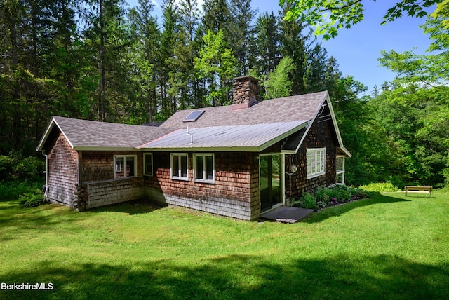 411 Bressett Rd, Williamstown, MA 01267 - back of property featuring a lawn, roof with shingles, and a chimney