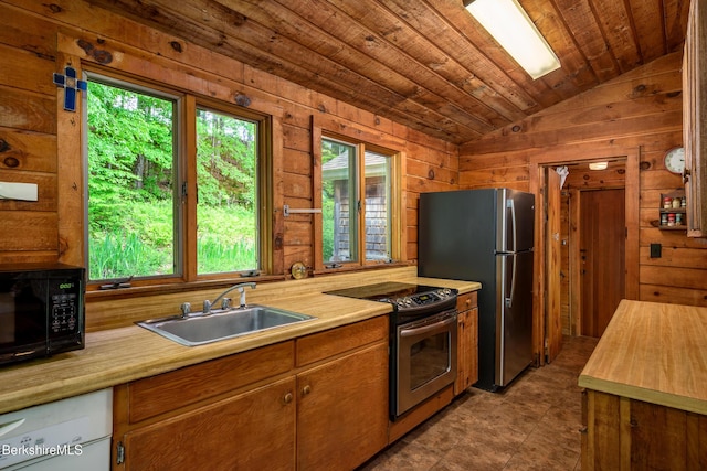 411 Bressett Rd, Williamstown, MA 01267 - kitchen featuring appliances with stainless steel finishes, a sink, lofted ceiling, wood walls, and wood ceiling