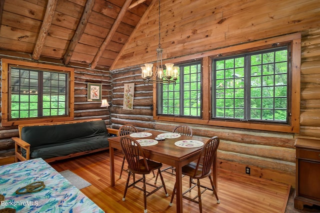 411 Bressett Rd, Williamstown, MA 01267 - dining room featuring rustic walls, healthy amount of natural light, wooden ceiling, a chandelier, and hardwood / wood-style floors
