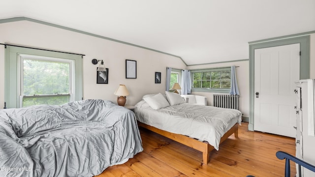 32 S Main Rd, Otis, MA 01253 - bedroom featuring radiator heating unit and light wood-style floors